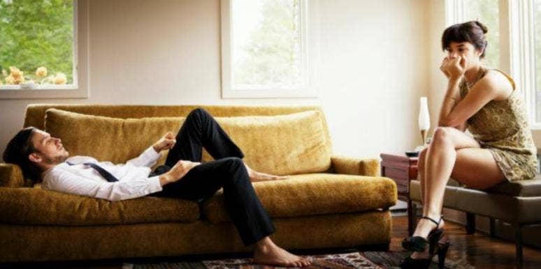 7 Signs You're The Controlling Partner In the Relationship man lying down on couch near woman sitting in chair