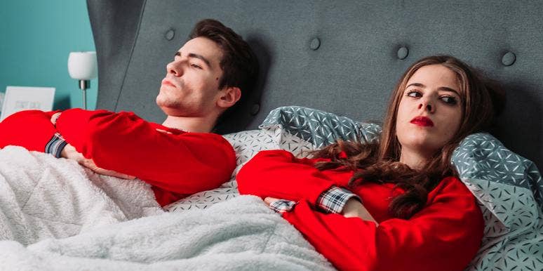 The Quietest, Possibly Most Destructive Of All Relationship Habits couple in bed