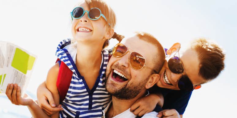 Parenting skills that are critical for single parents two kids play outdoors with their dad