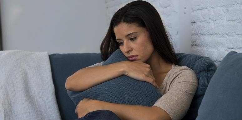 My Therapist Slut-Shamed Me woman looking sad, holding couch pillow