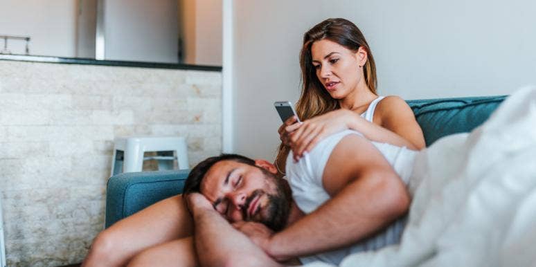I Snoop Through My Boyfriend's Phone — And Science Says I'm Not Alone woman snooping