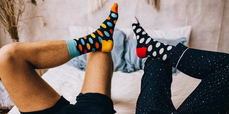 What Your Sock Drawer Bizarrely Reveals About Your Personality couple wearing socks
