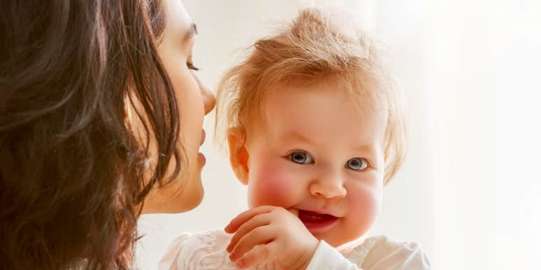 Someone Else’s Child Made Me A Mother woman holding baby