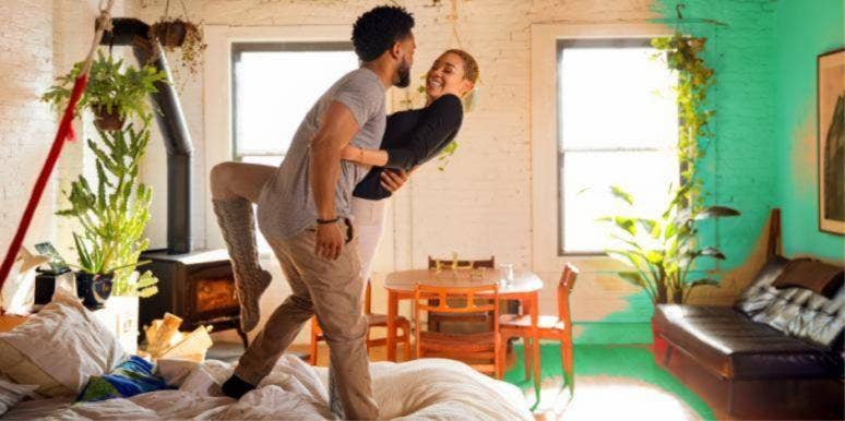 50 Best Song Lyrics About Relationships couple smiling holding each other dancing around