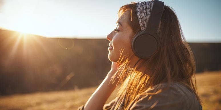 woman listening to music in sun