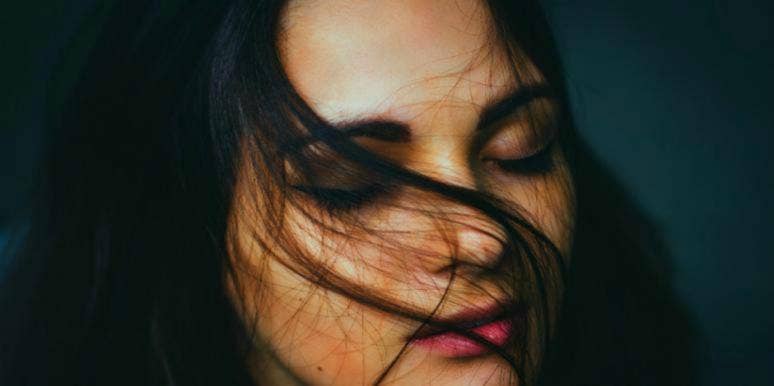 50 Songs About Death & Losing Someone To Help You Cope With Grief grieving woman missing someone who died