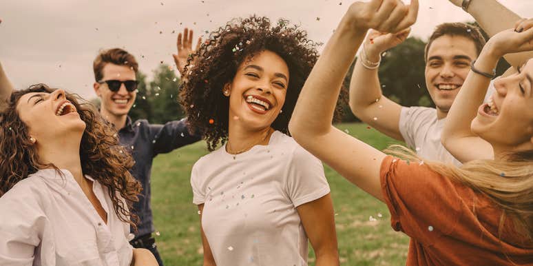 75 Happy Songs To Make You Smile & Feel Good group of people dancing and having fun