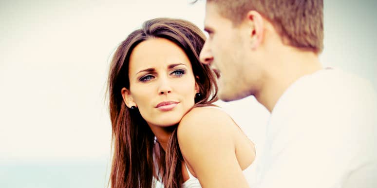 Soulmate doesn't love you back woman looking at man, serious expression