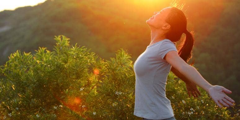 spiritual energy healing woman relaxing at sunset