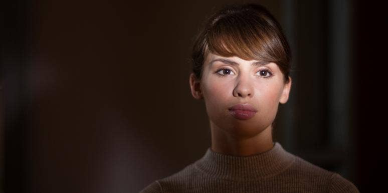 starlighting woman in darkness with light on her face