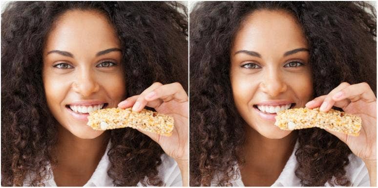woman eating cereal bar