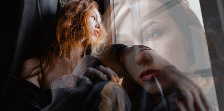 Woman realizing she needs to leave her current relationship. staring out the window