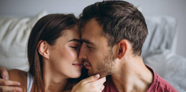 Strengthening Kegels: Everything You Need To Know man and woman kissing in bed