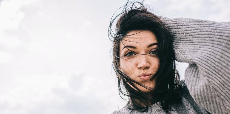stuck mindset happy woman in gray sweater