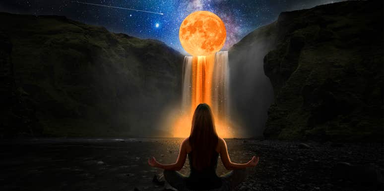 woman meditating waterfall with full moon