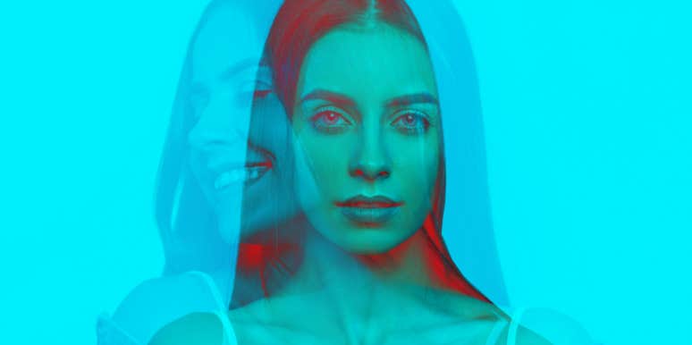 double-imposed image of a woman, tinted blue