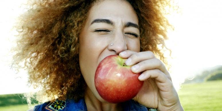 Superfoods To Support A Healthy Diet & Reduce Depression woman eating an apple