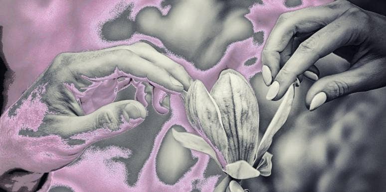 Where (And How) To Touch A Man's Taint To Make Him Orgasm man and woman touching flower