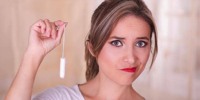 What Happened After I Had A Tampon Stuck In My Vagina For 9 Days woman holding tampon