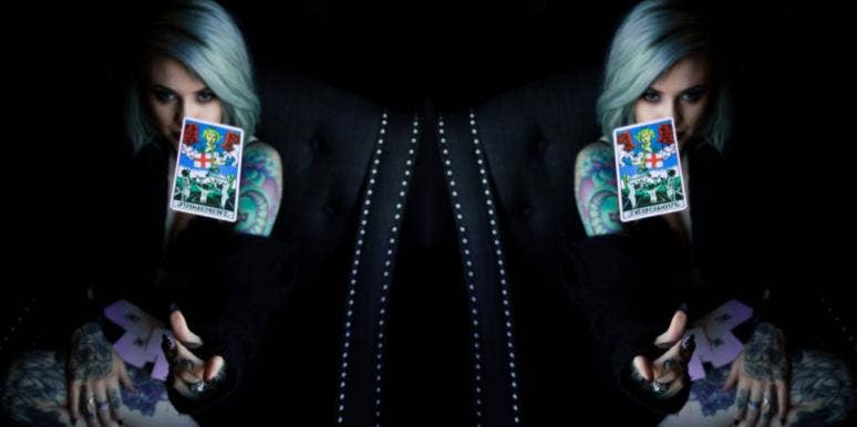 What Tarot Cards Represent Which Zodiac Signs In Astrology? woman throwing tarot cards