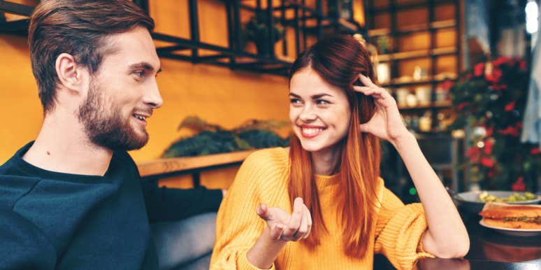 What To Say When Someone You're Dating Says, 'Tell Me About Yourself' couple flirting and talking