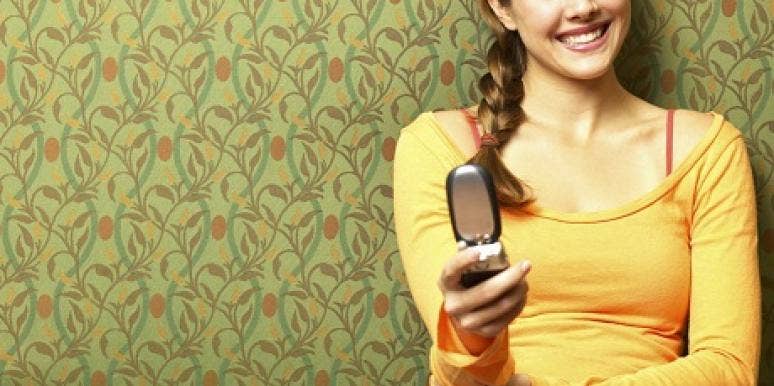 woman with cell phone Is This Normal? He Won't Stop Texting