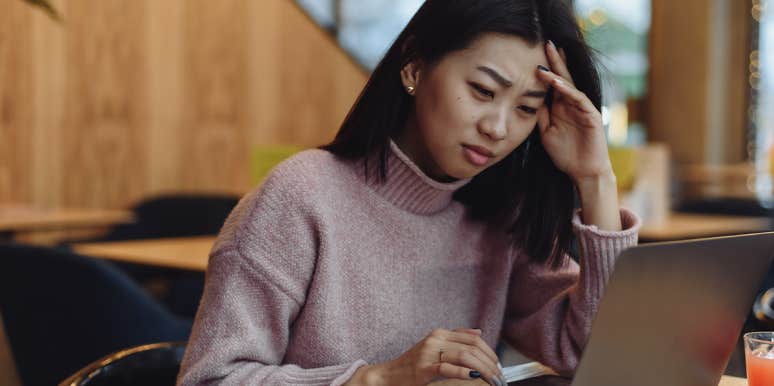 The Bizarre Reason A Creepy Man Froze My Match.com Account confused woman looking at laptop