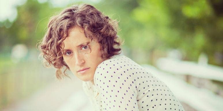 the truth about my divorce woman looking at the camera