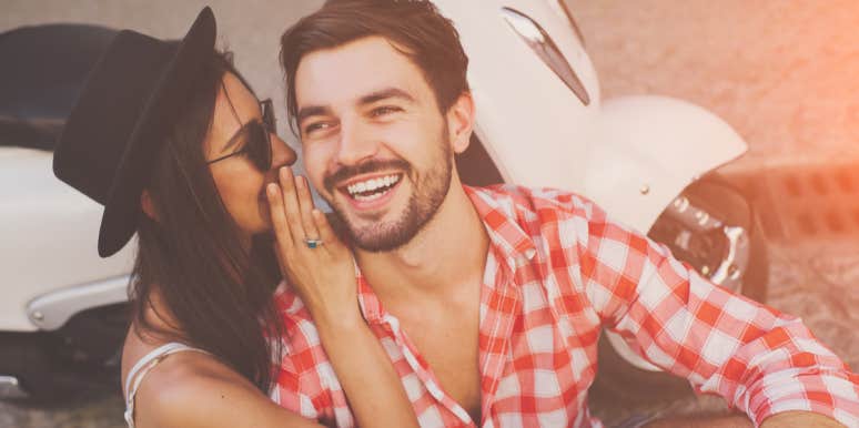 15 Things Guys Like To Hear From Women woman whispering in a man's ear