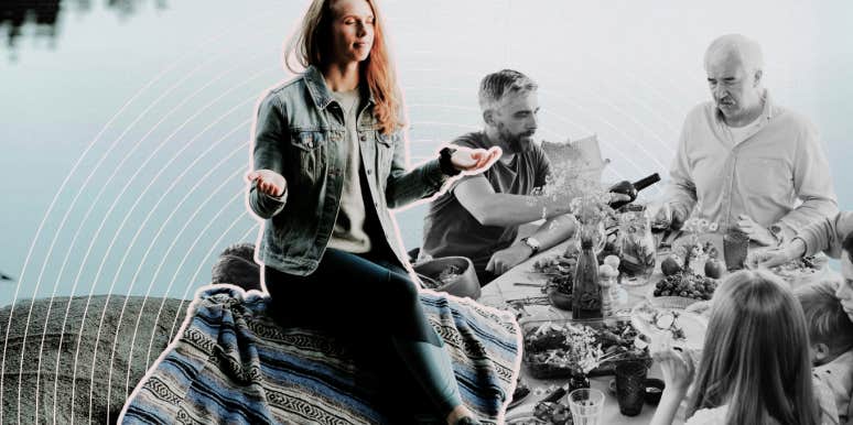 Woman sitting on a grey rock 