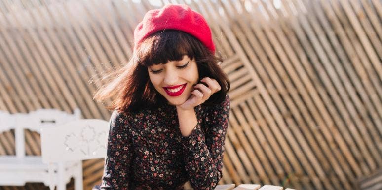 28 Tips For Living A Happy Life woman sitting outside and smiling