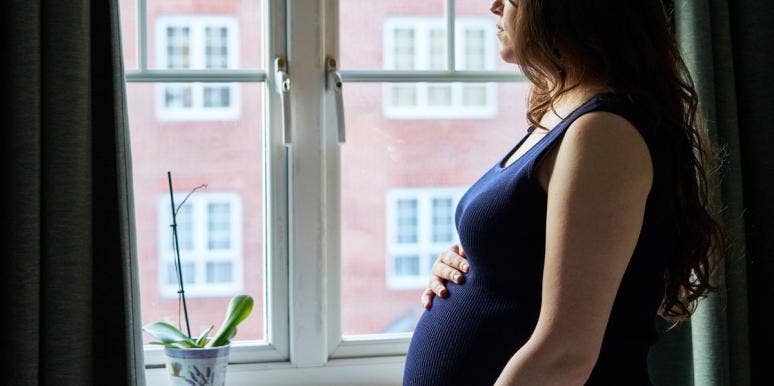 I Was Told I'm A "Bad Catholic" For Getting Artificially Inseminated pregnant woman looking out window