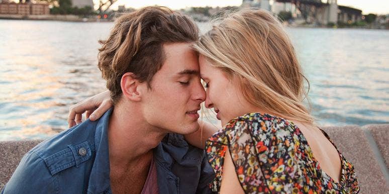 Your Tone Of Voice Can Predict How Long Your Relationship Will Last couple with foreheads touching