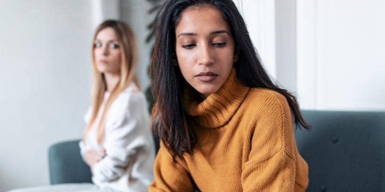 toxic friendship upset looking woman turning away from second woman