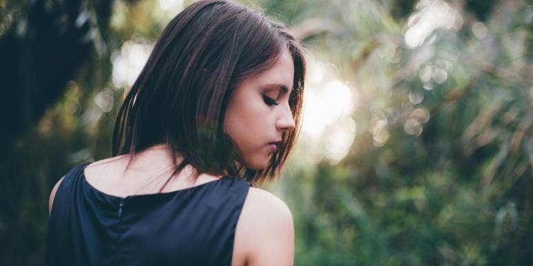 5 Things You Feel When He Toys With Your Emotions sad woman in trees