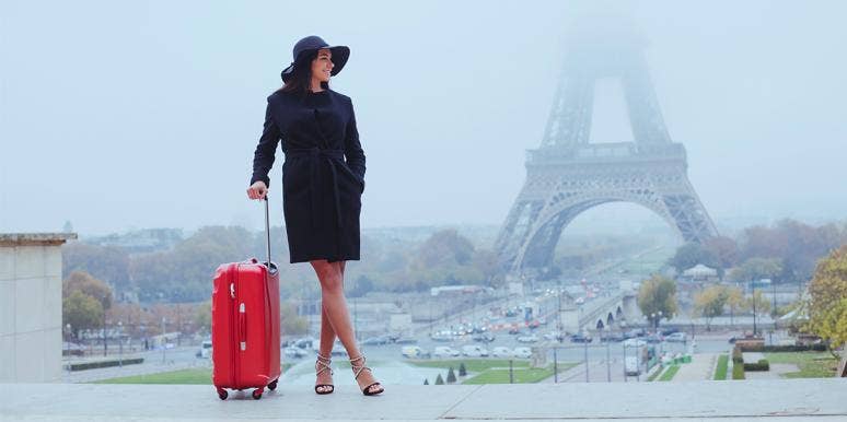 woman with suitcase in paris
