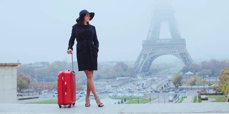 I Traveled Miles Around The World For The Love Affair Of The Century woman with suitcase in paris