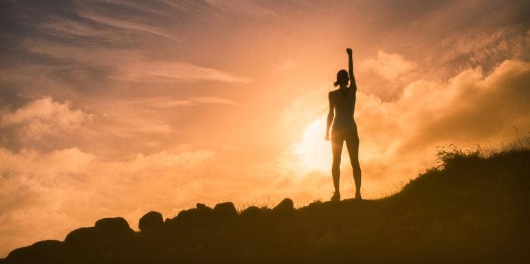 10 Little Tricks You Can Use To Be More Courageous woman on top of mountain