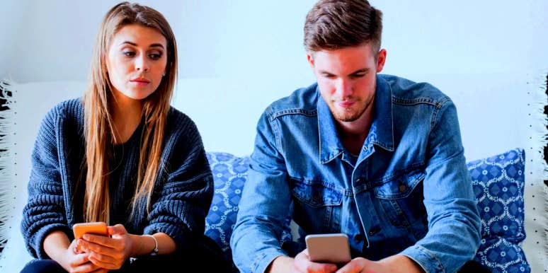Signs Of Trust Issues In A Relationship: Causes & How To Get Over Them woman with trust issues glancing at her boyfriend's phone