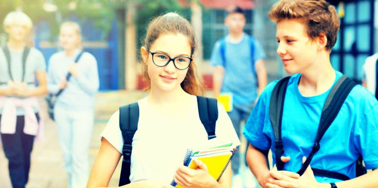 how to help your tween with their first love two kids, age 12, walk through school, boy clearly likes the girl