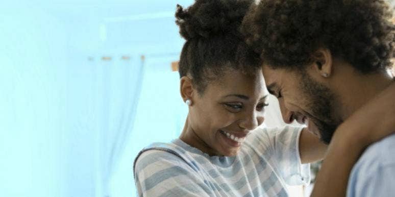 8 Twin Flame Stages & How To Know Which One You’re In twin flame couple hugging and laughing
