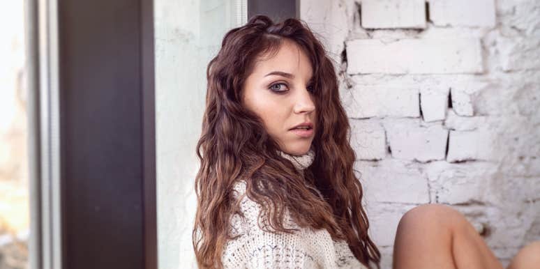 Harsh Signs You're Totally His Rebound woman looking to the camera