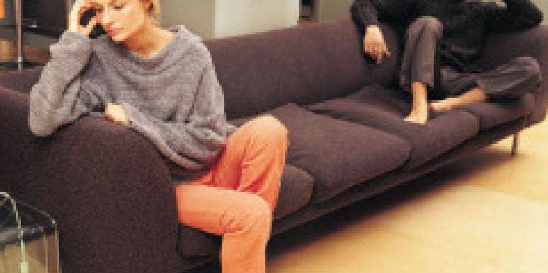 unhappy couple on couch