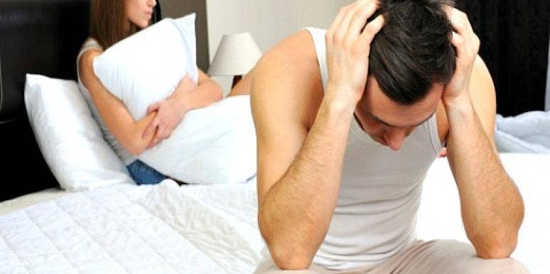upset couple in bed. upset couple in bed.