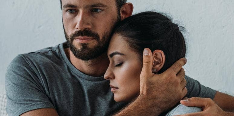 My Husband Had A Vasectomy — And We Both Regret It man cupping woman's face