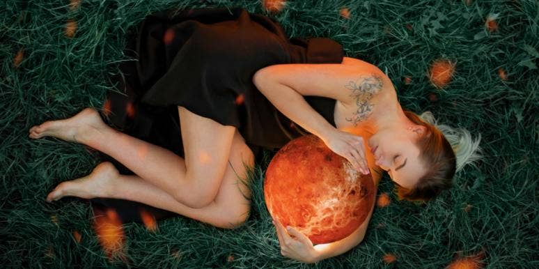 What’s My Venus Sign? Venus In The Signs Explained woman holding planet venus
