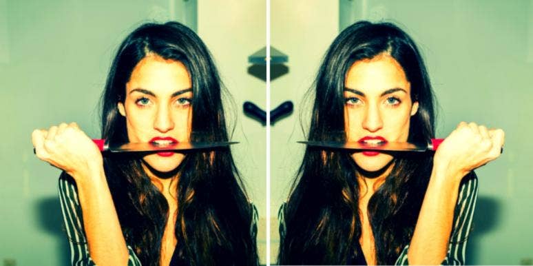 The 5 Most Vindictive Zodiac Signs In Astrology woman with a knife in her mouth