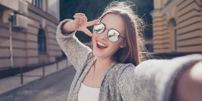 vision vs goals happy woman taking a selfie