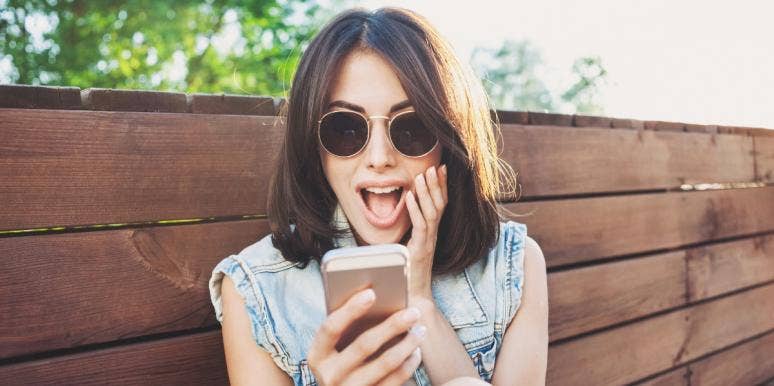 visualization to find love happy woman looking at her smartphone