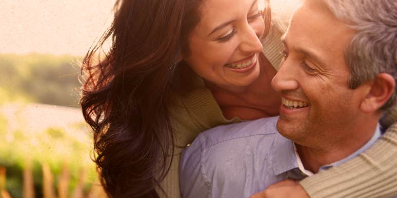 We Retired Early — One Secret That (Regularly) Saves Us couple hugging in nature